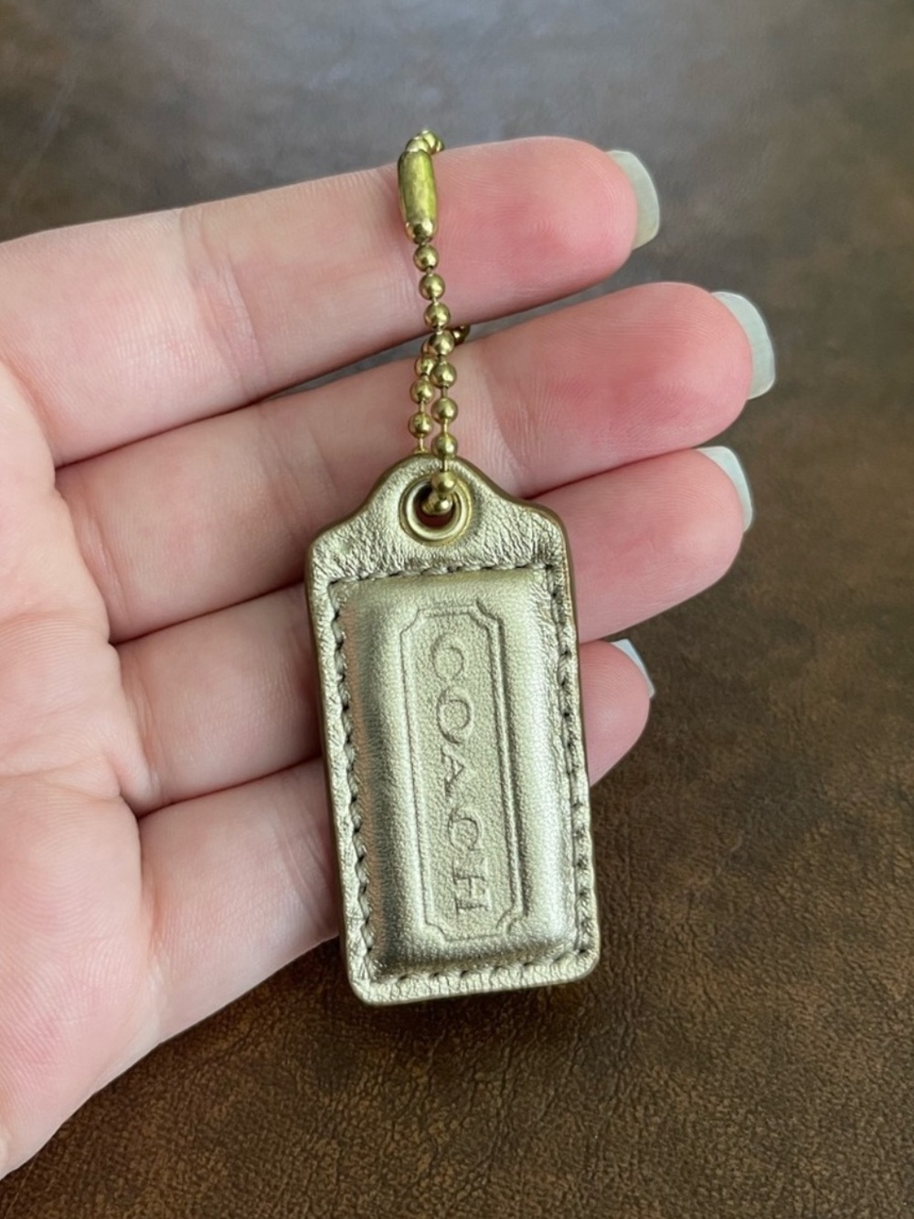 Gold coach hang tag